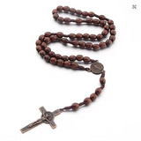 Wood Cord Rosary Dark Brown Oval Beads St Benedict Crucifix and center CD03